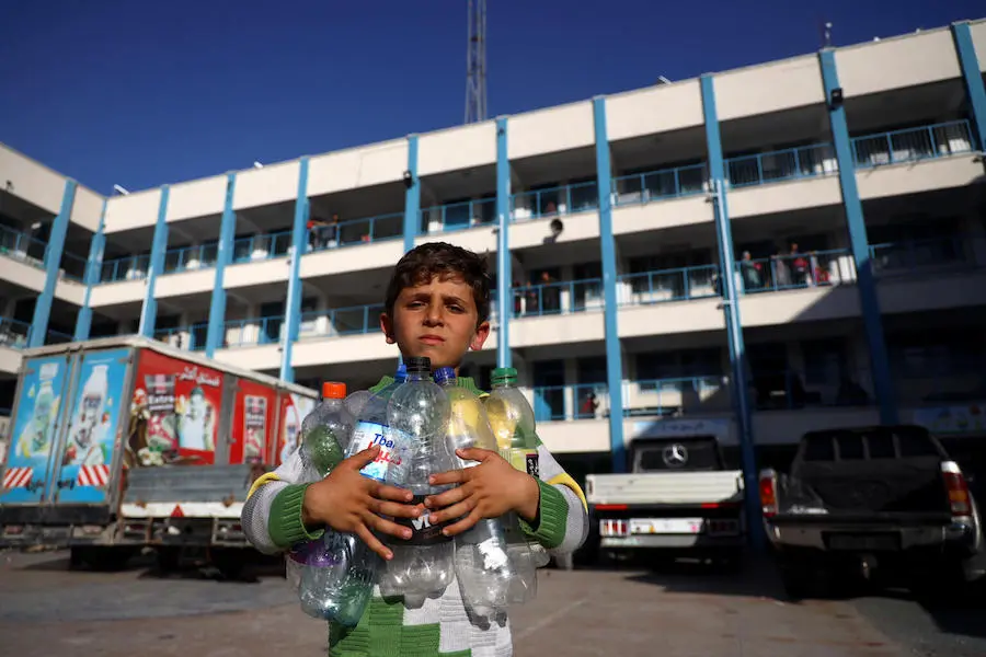 Young Boy with Plastic Bottles