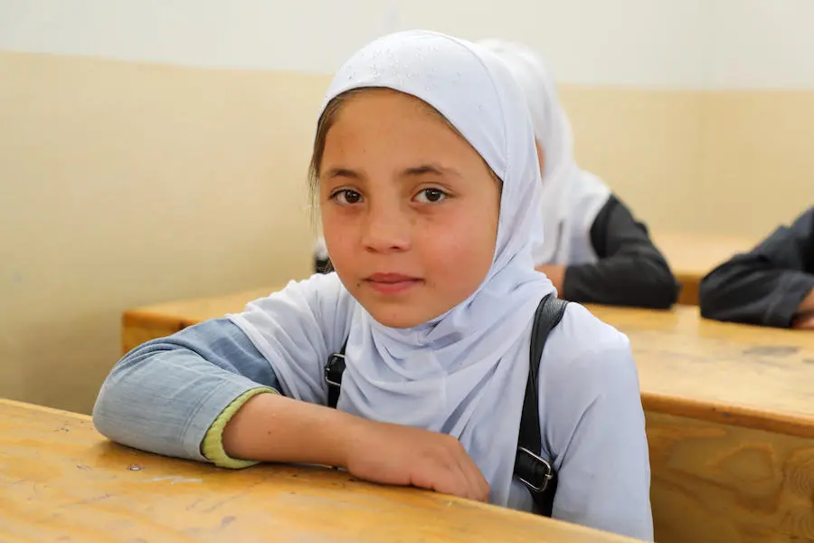 Girl at School Desk