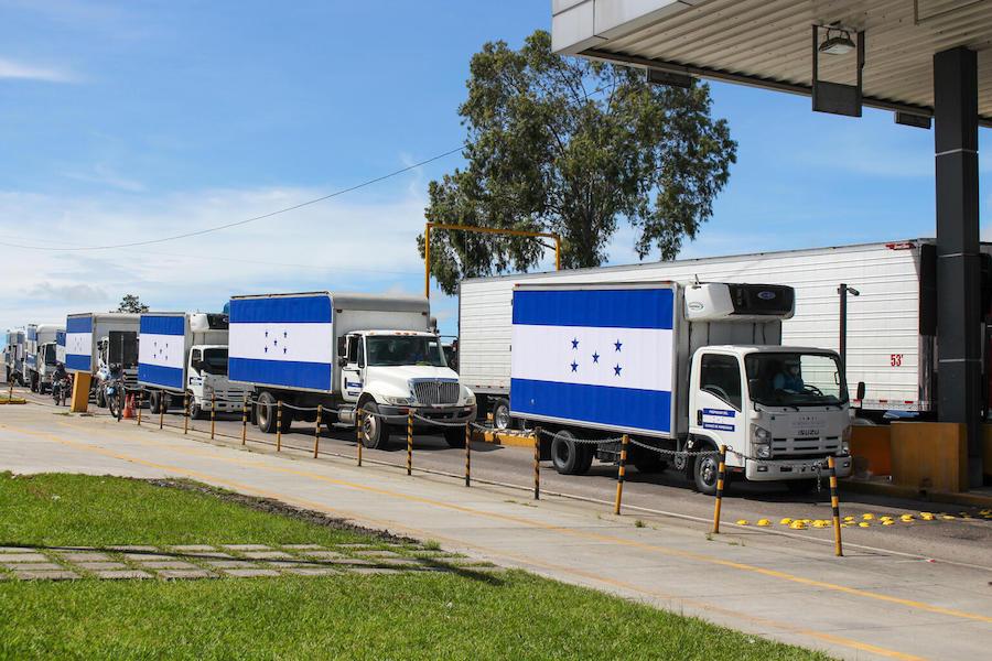 Refrigerated trucks on the road from Tegucigalpa to San Pedro Sula, in Honduras, to transport 1.5 million doses of COVID-19 vaccines donated by United States Government to Honduras via COVAX’s dose-sharing mechanism on June 27, 2021.. 