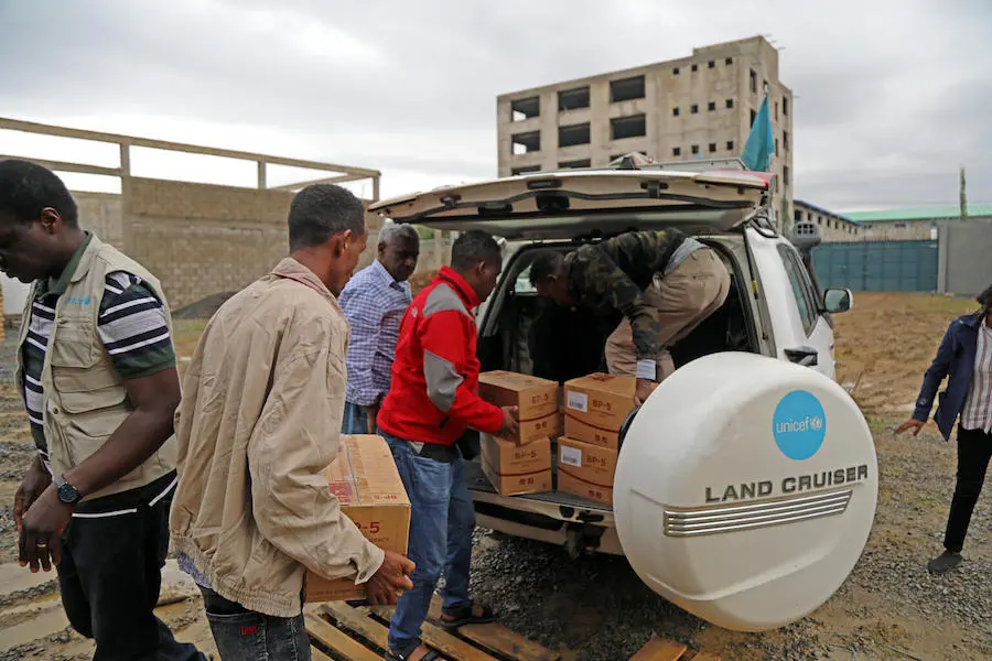 Men Unloading Supplies