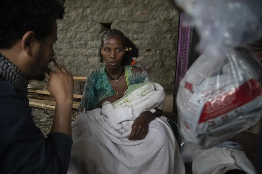 Woman Feeding Baby