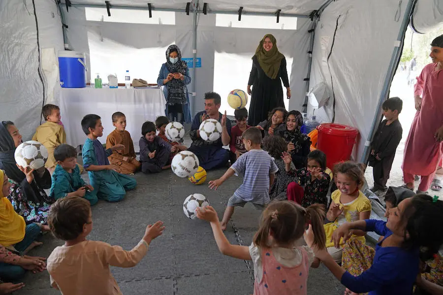 On August 14, 2021, children participate in a recreational activity at a UNICEF Child-Friendly Space at Peer Mohammad Kakar high school where more than 400 families are sheltering having fled instability and conflict to Kabul. On August 14, 2021, children participate in a recreational activity at a UNICEF Child-Friendly Space at Peer Mohammad Kakar high school where more than 400 families are sheltering having fled instability and conflict to Kabul.