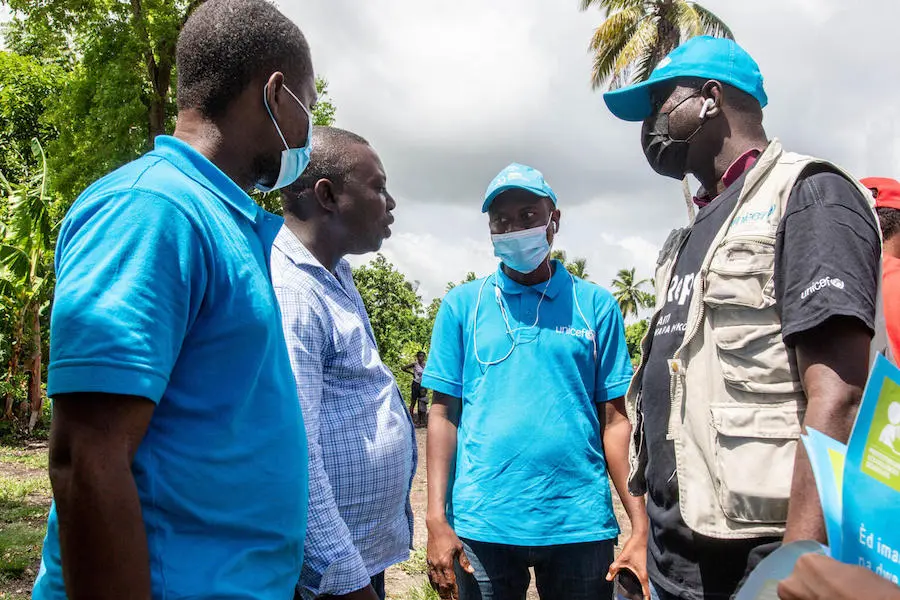 On August 18, 2021 UNICEF staff talk to the Deputy Mayor of the municipality of Torbeck before the distribution of emergency supplies in Valere, a village in the Torbeck commune of the Les Cayes Arrondissement, in Haiti’s Sud Department. On August 18, 2021 UNICEF staff talk to the Deputy Mayor of the municipality of Torbeck before the distribution of emergency supplies in Valere, a village in the Torbeck commune of the Les Cayes Arrondissement, in Haiti’s Sud Department.