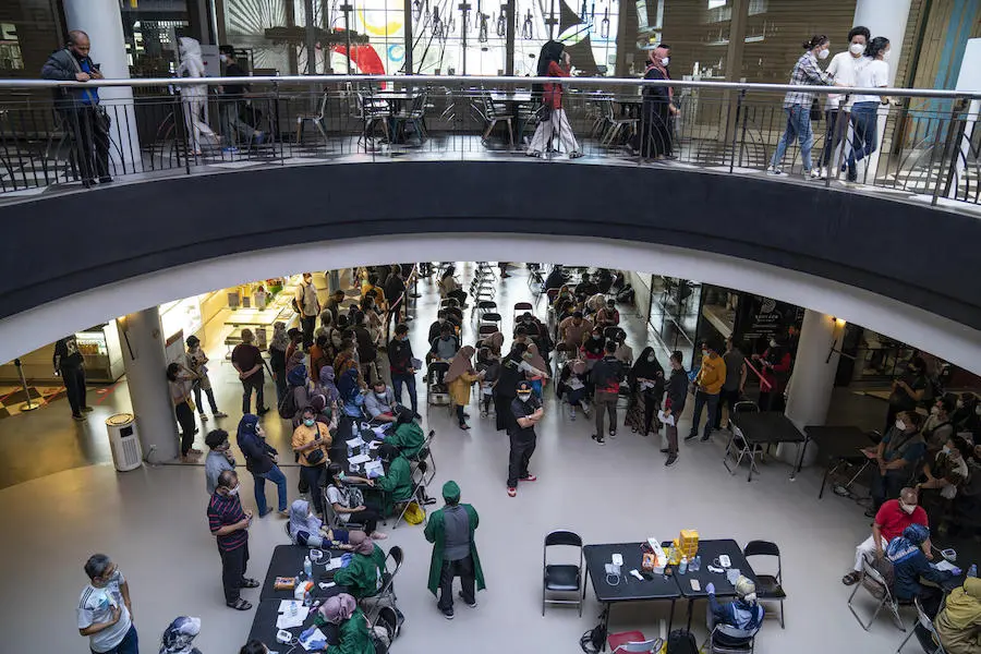 Jakarta residents register to receive their COVID-19 vaccine at the Cilandak Town Square Mall in South Jakarta, Indonesia, on August 24, 2021. Jakarta residents register to receive their COVID-19 vaccine at the Cilandak Town Square Mall in South Jakarta, Indonesia, on August 24, 2021.