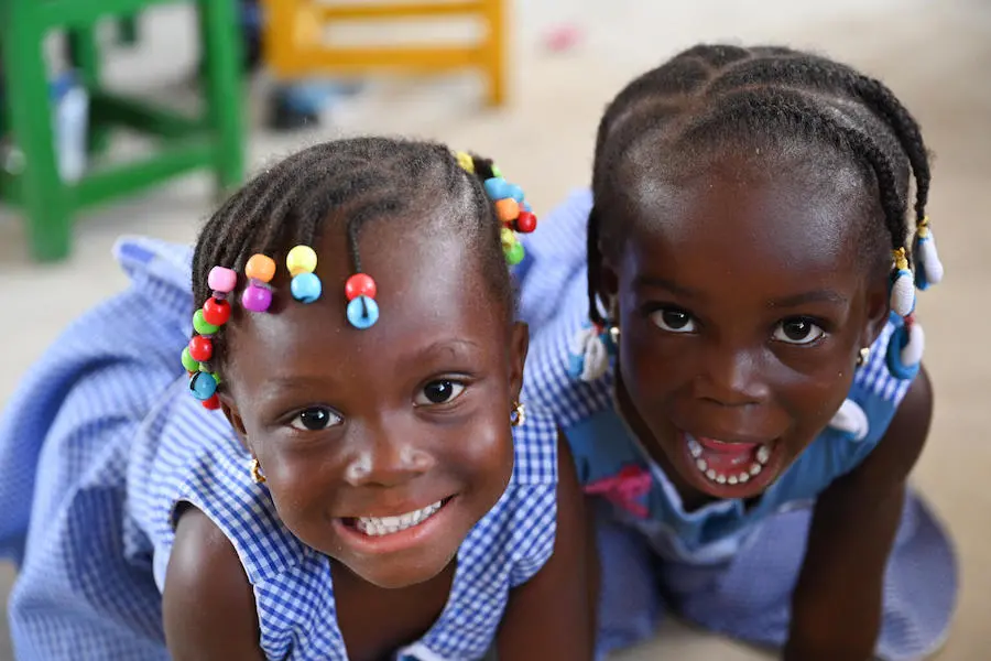 Children, happy for the start of the school year in September 2021, in Yopougon, a suburban of abidjan, in the south of Côte d'Ivoire. Children, happy for the start of the school year in September 2021, in Yopougon, a suburban of abidjan, in the south of Côte d'Ivoire.