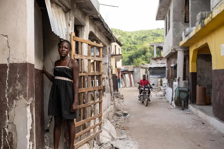 Woman Standing in Alleyway