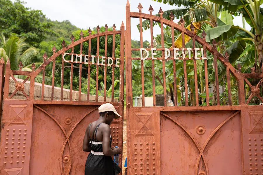 Woman Walking into Cemetery