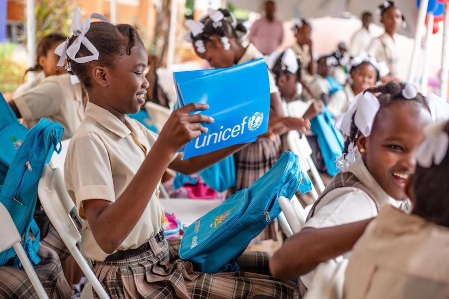 A student opens her schoolbag on the first day of the school in Les Cayes, Haiti on October 4, 2021.