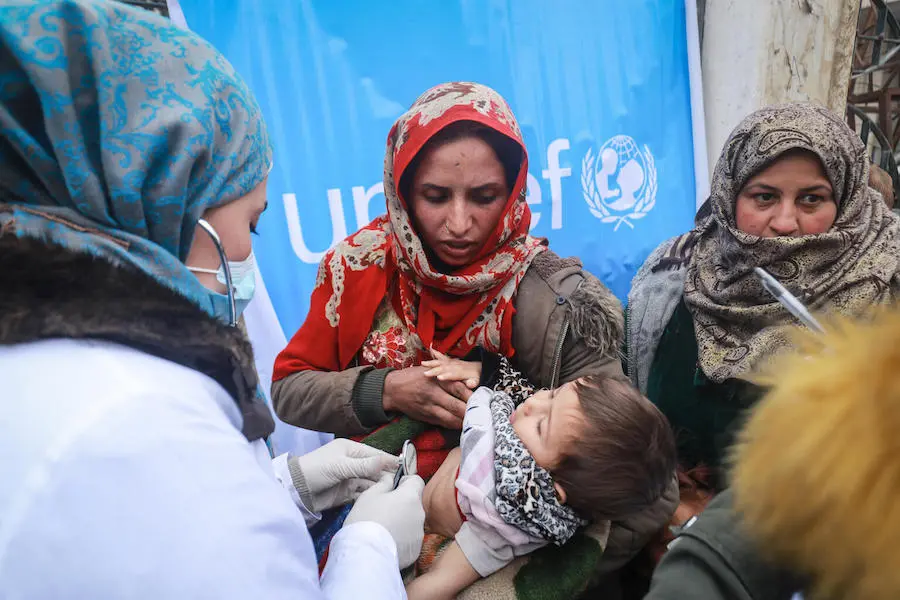 Internally displaced mothers bring their children to the UNICEF-supported health and nutrition mobile clinic for consultation and distribution of medicine at Musab Bin Omair mosque, Tal Hajar, Hasakah city, northeast Syria on January 27, 2022. Internally displaced mothers bring their children to the UNICEF-supported health and nutrition mobile clinic for consultation and distribution of medicine at Musab Bin Omair mosque, Tal Hajar, Hasakah city, northeast Syria on January 27, 2022.