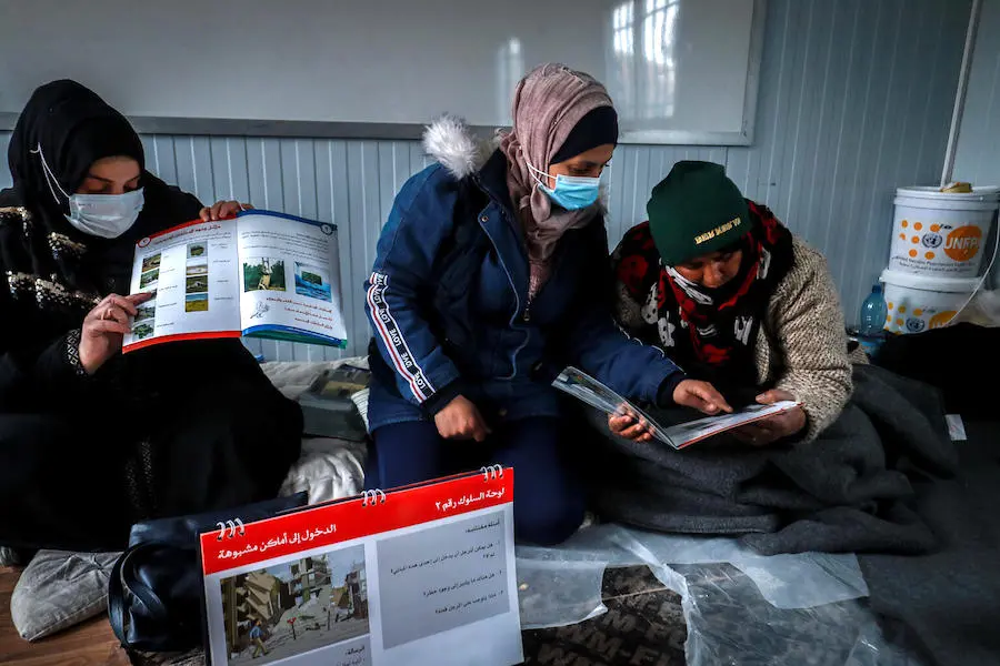 Internally displaced women and girls attending sessions on mine risk awareness, supported by UNICEF and partners, at Waleed Nofal school in Hasakah city, northeast Syria on January 27, 2022. Internally displaced women and girls attending sessions on mine risk awareness, supported by UNICEF and partners, at Waleed Nofal school in Hasakah city, northeast Syria on January 27, 2022.