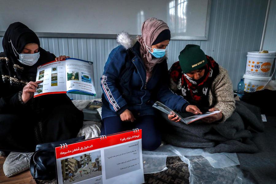 Internally displaced women and girls attending sessions on mine risk awareness, supported by UNICEF and partners, at Waleed Nofal school in Hasakah city, northeast Syria on January 27, 2022.