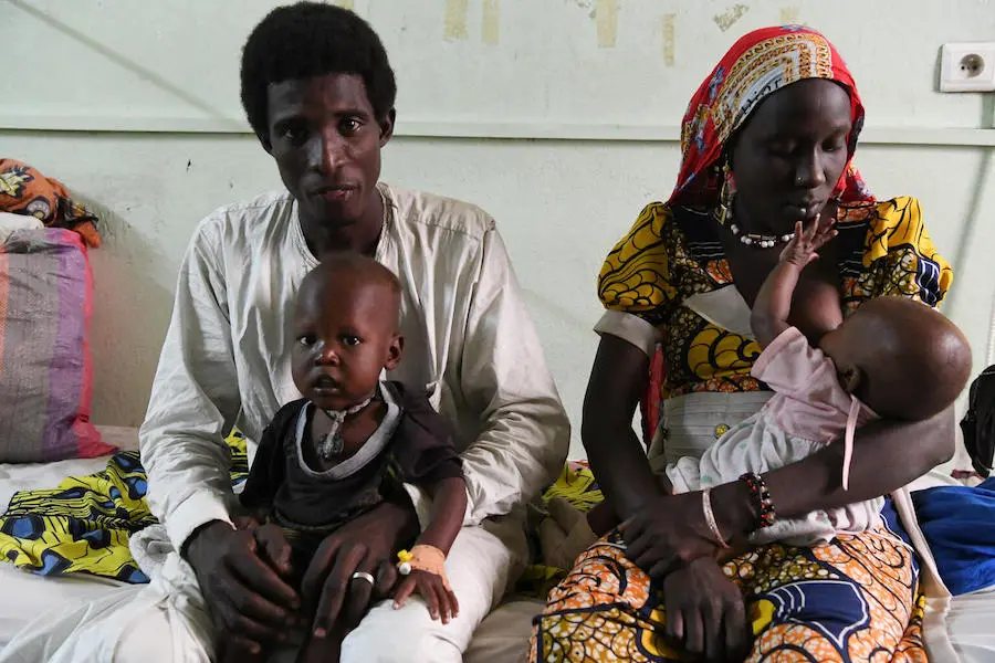 Ahmat Djibine,20, and his wife Halima, 17, traveled 80 miles to bring their malnourished 3-year-old son, Anahim, to the UNICEF-supported nutrition unit at Nôtre Dame des Apôtres hospital in Ndjamena, the capital of Chad. Ahmat Djibine,20, and his wife Halima, 17, traveled 80 miles to bring their malnourished 3-year-old son, Anahim, to the UNICEF-supported nutrition unit at Nôtre Dame des Apôtres hospital in Ndjamena, the capital of Chad.