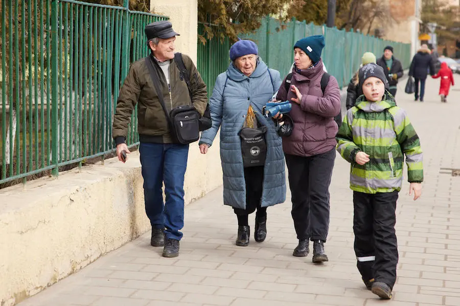 People Walking on the Sidewalk