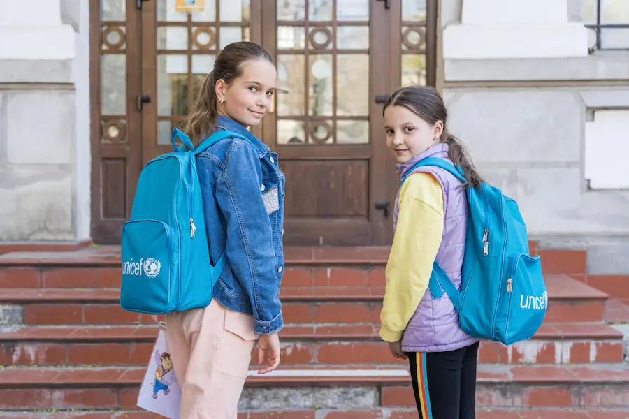 UNICEF provided recreation kits and educational materials to a pop-up primary school for Ukrainian refugees in Bucharest, Romania. Students at a Bucharest primary school for newly arrived Ukrainian refugee children like Sofiya, left, and Liza received backpacks and supplies from UNICEF.