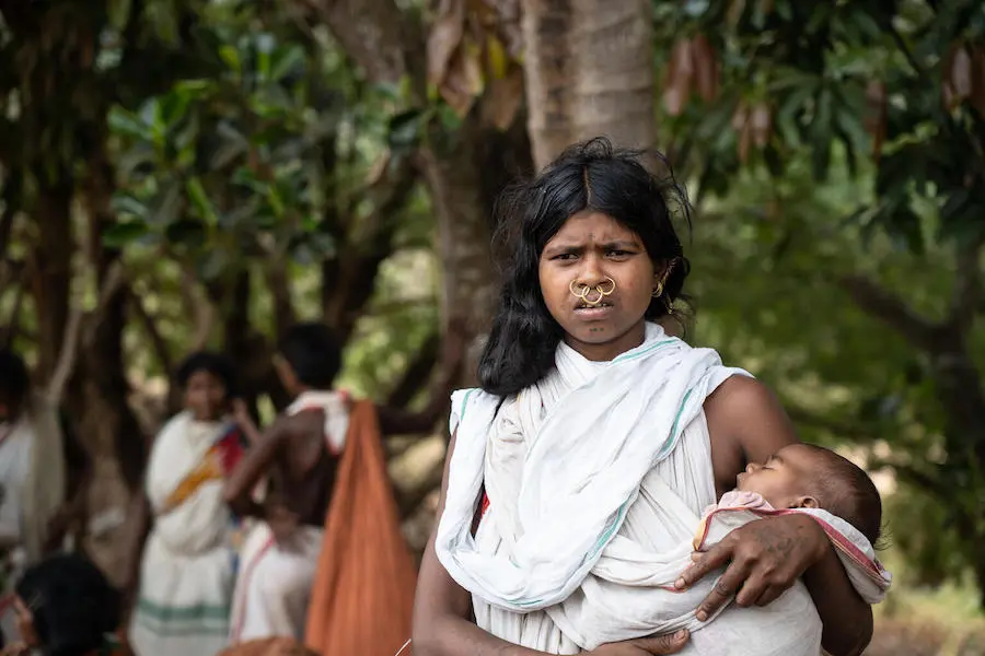 Three-month-old Chumki sleeps in her mother's arms after receiving her scheduled vaccinations in the state of Odisha in eastern India. Three-month-old Chumki sleeps in her mother's arms after receiving her scheduled vaccinations in the state of Odisha in eastern India.