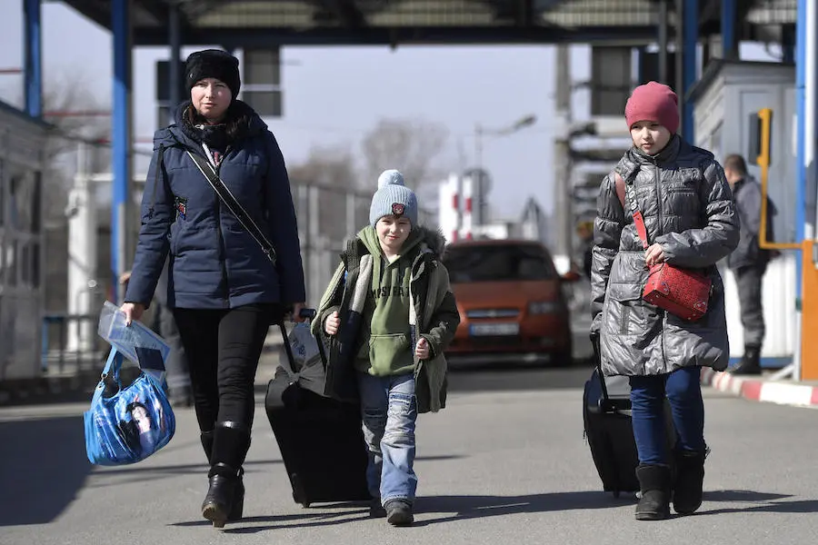 Olena, left, and her children Andrei, 6, and Anastasia, 11, fled the war in Ukraine, crossing the border into Romania on April 8, 2022. Olena, left, and her children Andrei, 6, and Anastasia, 11, fled the war in Ukraine, crossing the border into Romania on April 8, 2022.