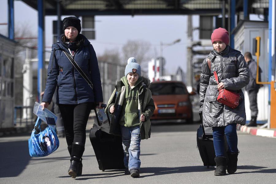 Olena, left, and her children Andrei, 6, and Anastasia, 11, fled the war in Ukraine, crossing the border into Romania on April 8, 2022.