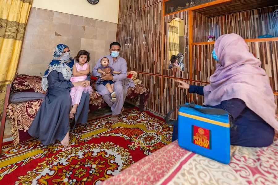 Izzat Begum, a polio community mobilizer, visits a family in Karachi, who were hesistant about vaccinating their two daughters, both under the age of 5. Izzat Begum, a polio community mobilizer, visits a family in Karachi, who were hesistant about vaccinating their two daughters, both under the age of 5.