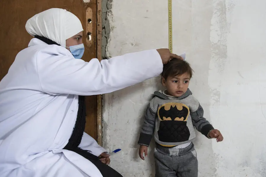 On March 6, 2022, a member of a UNICEF-supported mobile health team measures Ishak, who is being treated for malnutrition in East Ghouta, Rural Damascus, Syria. On March 6, 2022, a member of a UNICEF-supported mobile health team measures Ishak, who is being treated for malnutrition in East Ghouta, Rural Damascus, Syria, on March 6, 2022.