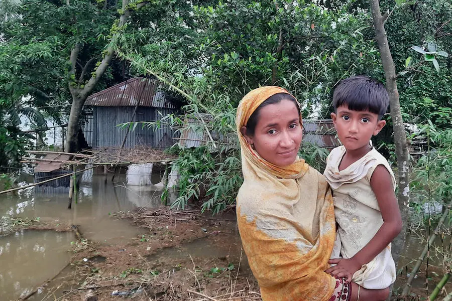 In May 2022, floodwaters poured into the tin house where Rukhsana Akhtar Kajol, 28, and her 4-year-old daughter, Nusrat, live in Sylhet, Bangladesh. In May 2022, floodwaters poured into the tin house where Rukhsana Akhtar Kajol, 28, and her 4-year-old daughter, Nusrat, live in Sylhet, Bangladesh.