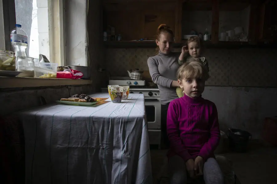 Vika, 8, of Avdiivka, eastern Ukraine, with her mother Hanna and younger sibling at their temporary home in Cherkasy oblast. Vika, 8, of Avdiivka, eastern Ukraine, with her mother Hanna and younger sibling at their temporary home in Cherkasy oblast.