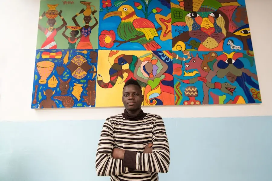 Man in Front of Mural
