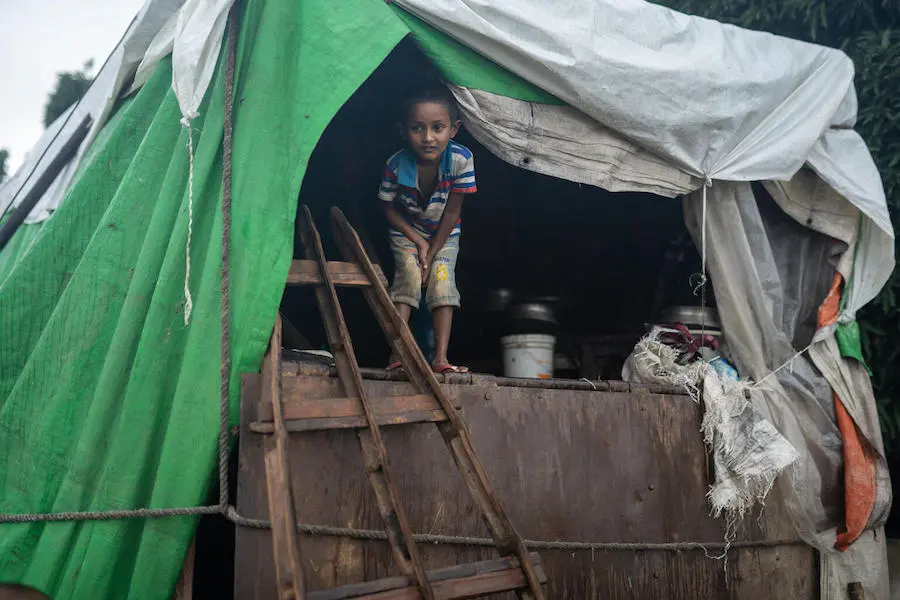 Boy in Makeshift Shelter
