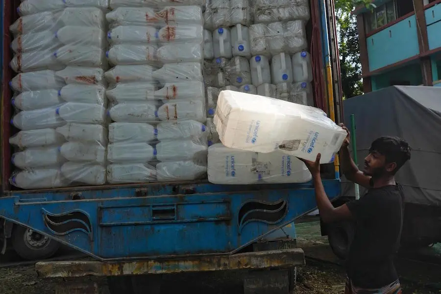 A worker unloads UNICEF emergency supplies for flood-affected families in Sylhet, Bangladesh on June 22, 2022. A worker unloads UNICEF emergency supplies for flood-affected families in Sylhet, Bangladesh on June 22, 2022.