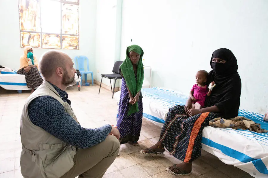 UNICEF Emergency Director Manuel Fontaine visits with 1-year-old Ukubi who is being treated for severe acute malnutrition at UNICEF-supported Asayita hospital in Afar, Ethiopia. UNICEF Emergency Director Manuel Fontaine visits with 1-year-old Ukubi who is being treated for severe acute malnutrition at UNICEF-supported Asayita hospital in Afar, Ethiopia.