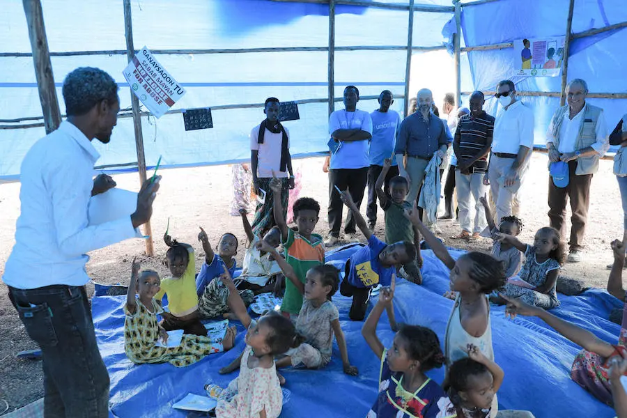 A teacher conducts a lesson with children inside a UNICEF Child-Friendly Space at the Agatina IDP site in Afar, Ethiopia, where UNICEF is helping to meet the needs of children displaced by severe drought. A teacher conducts a lesson with children inside a UNICEF Child-Friendly Space at the Agatina IDP site in Afar, Ethiopia, where UNICEF is helping to meet the needs of children displaced by severe drought.