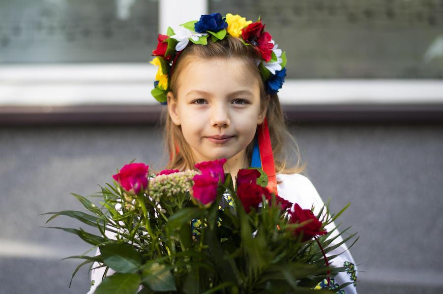Seven-year-old Emilia, from Irpin, Ukraine, brought two bouquets of flowers to school on the first day in Krakow, Poland, one for her tutor and one for the school principal.