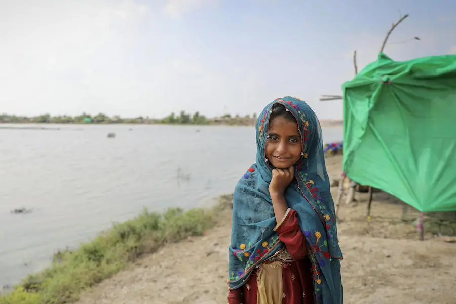 Girl Standing in Front of Water