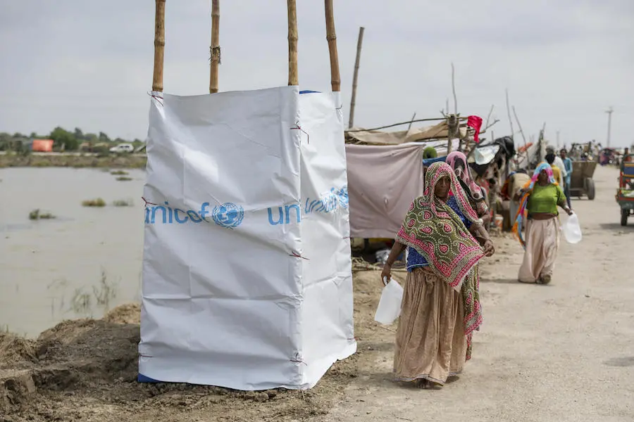 UNICEF set up temporary toilets and is spreading awareness of the dangers of open defecation in Pakistan after torrential monsoon rains left one-third of the country underwater in Sept. 2022. . UNICEF set up temporary toilets and is spreading awareness of the dangers of open defecation in Pakistan after torrential monsoon rains left one-third of the country underwater in Sept. 2022. .