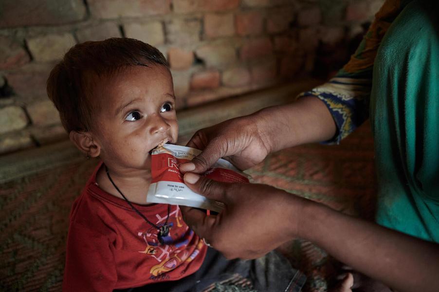 Azaan Ali, 16 months old, is fed Ready-to-Use Therapeutic Food by his mother in Pakistan's Sindh Province.