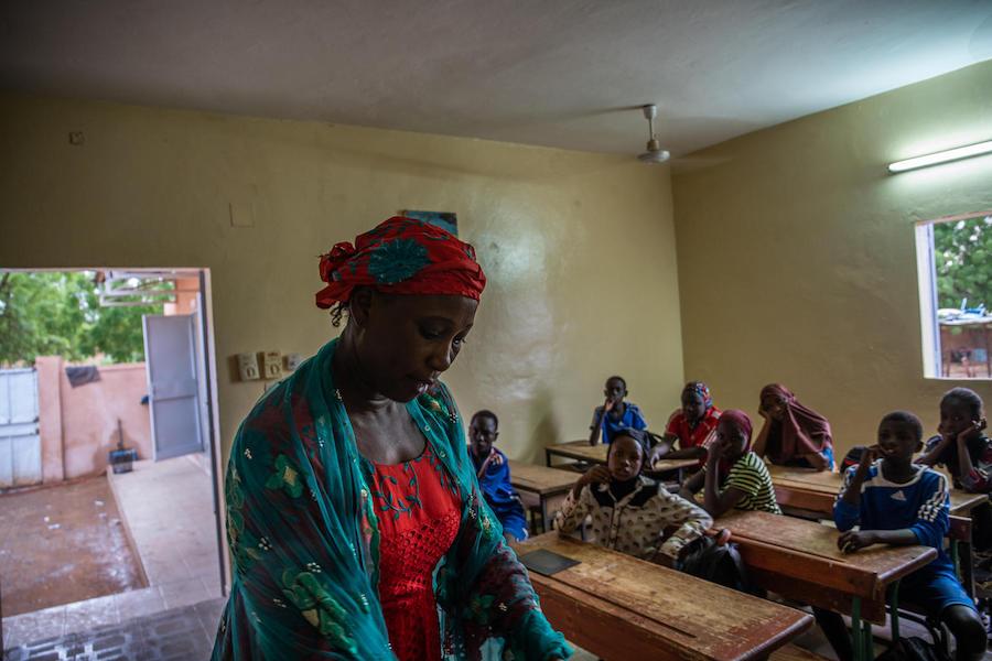 Garba Rahama, left, teaches at a UNICEF-supported primary school in Niamey, Niger.