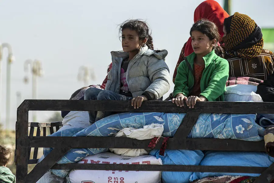 Families in northeast Syria continue to flee escalating violence in October 2019. Families in northeast Syria continue to flee escalating violence in October 2019.