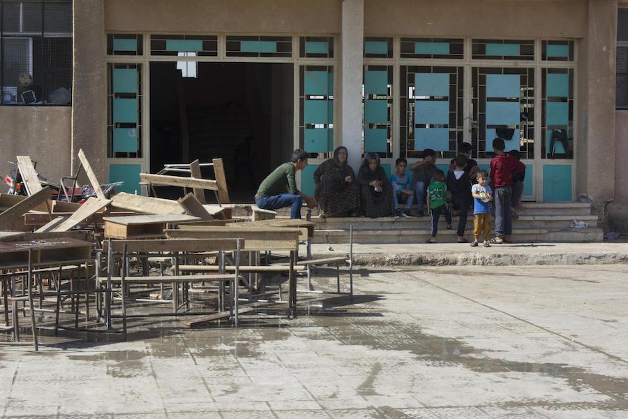 Many displaced families in northeast Syria are staying in collective shelters in schools and unfinished buildings. 