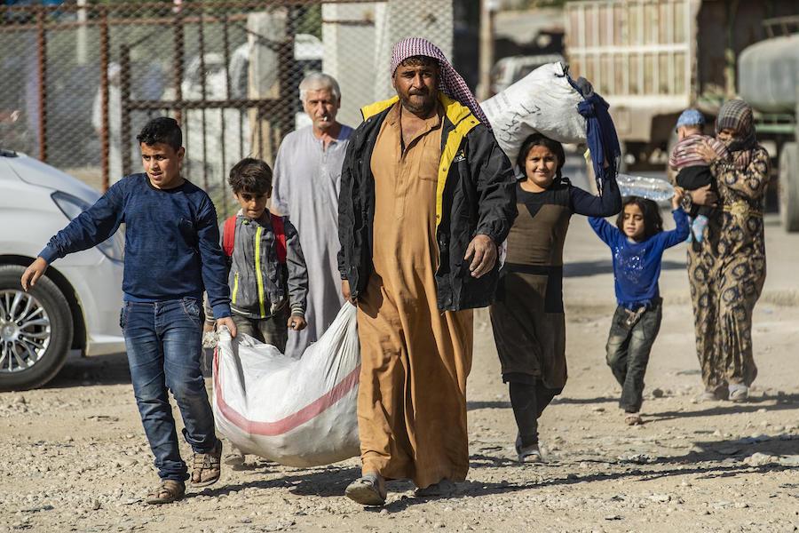 In October 2019, families fleeing escalating violence in northeast Syria continue to arrive in Tal Tamar. 