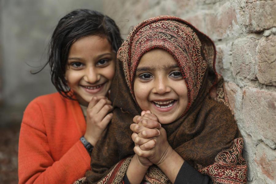 Anessa (right) and Rashida stand outside their home in Dara Chaudhry Kamran, Lahore Punjab Province, Pakistan in January 2019.