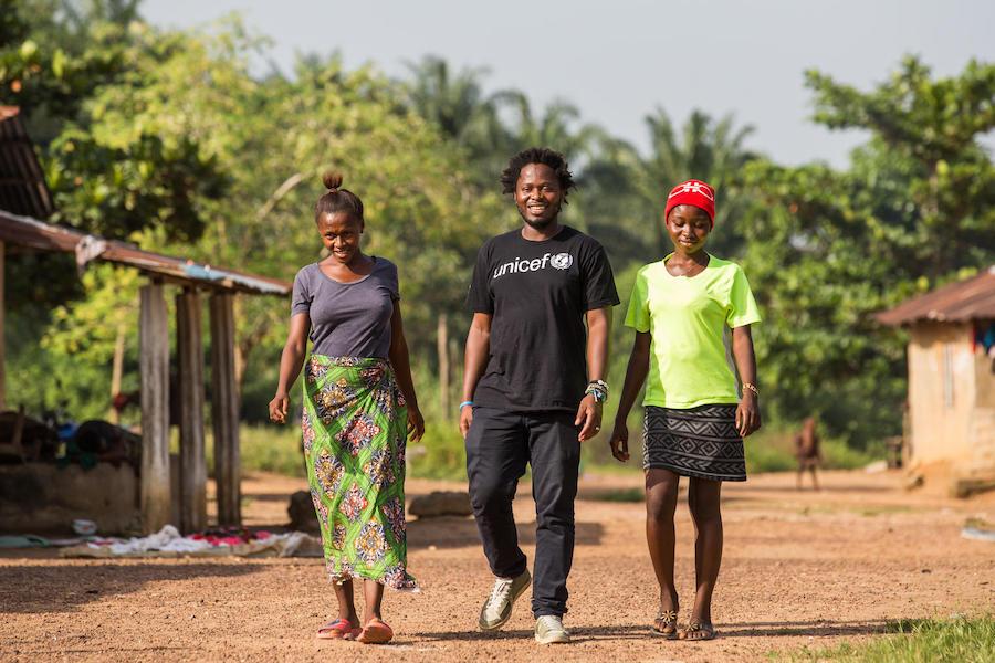 On November 20, 2019, former child soldier and UNICEF Goodwill Advocate for Children Affected by War Ishmael Beah met with orphaned cousins Isatu, 17 (left) and Fatmata, 15, in Sierra Leone. 