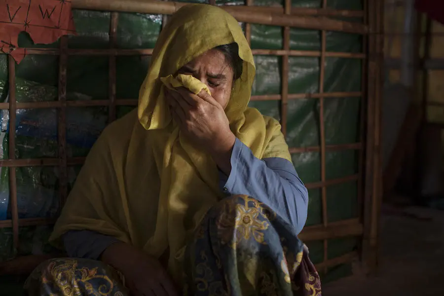 On December 1, 2019, at Balukhali refugee camp in Cox’s Bazar, Bangladesh, Fatima Begum cries in her home as she speaks about the disappearance of her daughter, Jannat Ara, 16, who went missing nine months ago. On December 1, 2019, at Balukhali refugee camp in Cox’s Bazar, Bangladesh, Fatima Begum cries in her home as she speaks about the disappearance of her daughter, Jannat Ara, 16, who went missing nine months ago.