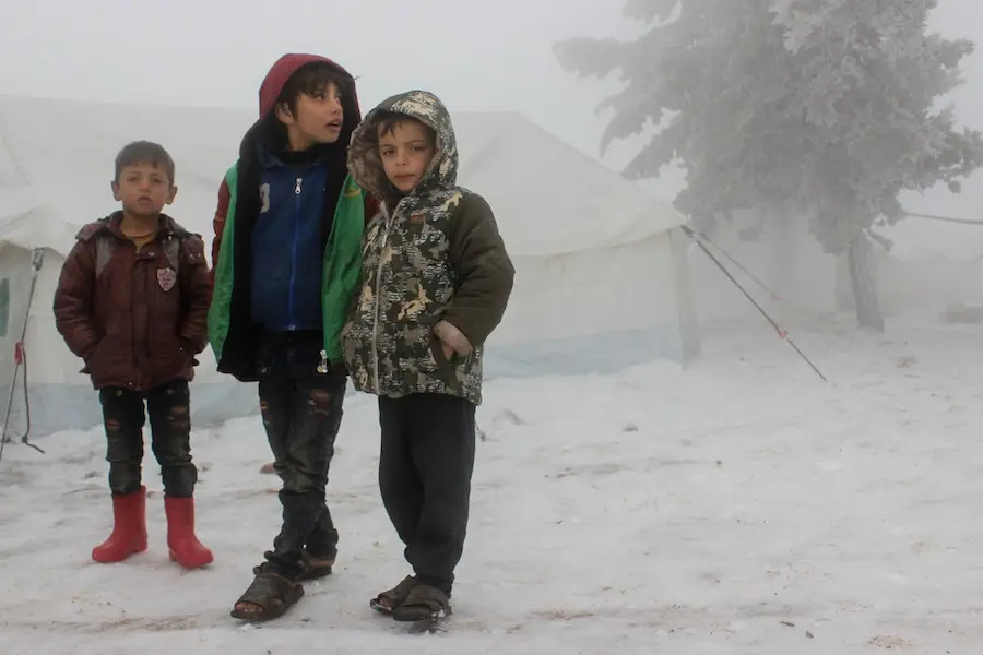On 13 February 2020, boys stand together at an informal settlement in the Syrian Arab Republic near the Turkish border. The settlement houses around 500 displaced families from eastern Ghouta and rural Idlib and western rural Aleppo governorates. On 13 February 2020, boys stand together at an informal settlement in the Syrian Arab Republic near the Turkish border. The settlement houses around 500 displaced families from eastern Ghouta and rural Idlib and western rural Aleppo governorates.