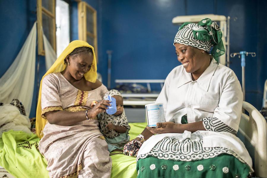Moulidi Cissé, a nurse at the regional hospital of Timbuktu, Mali, on a hospital bed with Maya Ag Oumar, 12 months, and her mother Aminata Cissé, 20, in March 2020. 