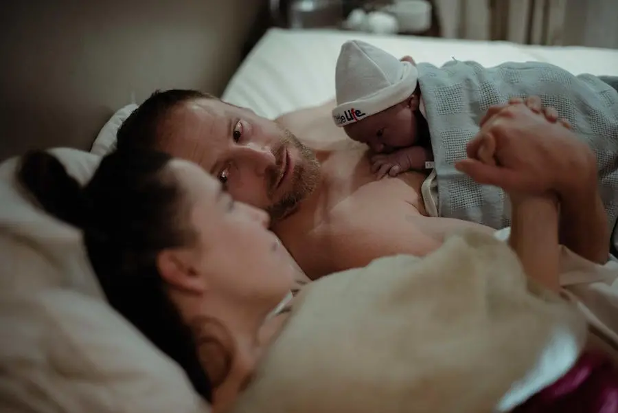 Woman and Man with Newborn Baby