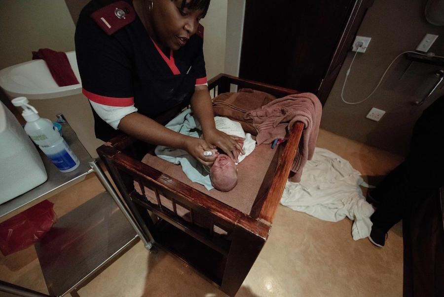 Nurse Treating Newborn Baby