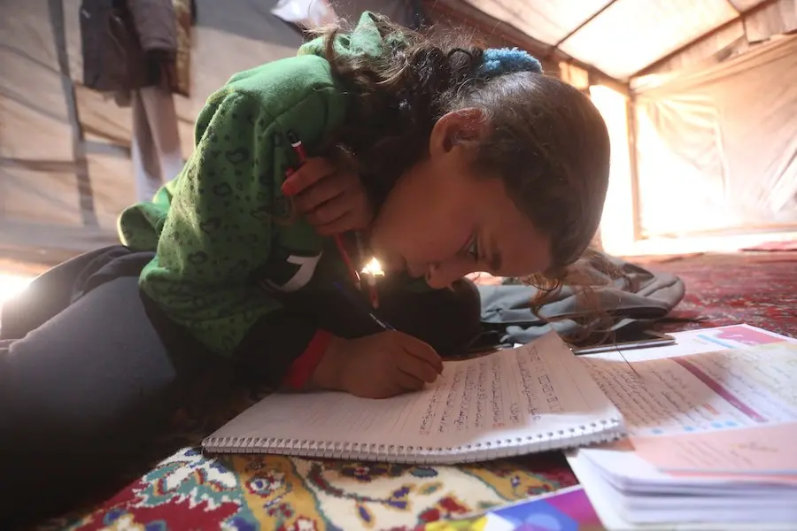 Girl Writing on Notebook