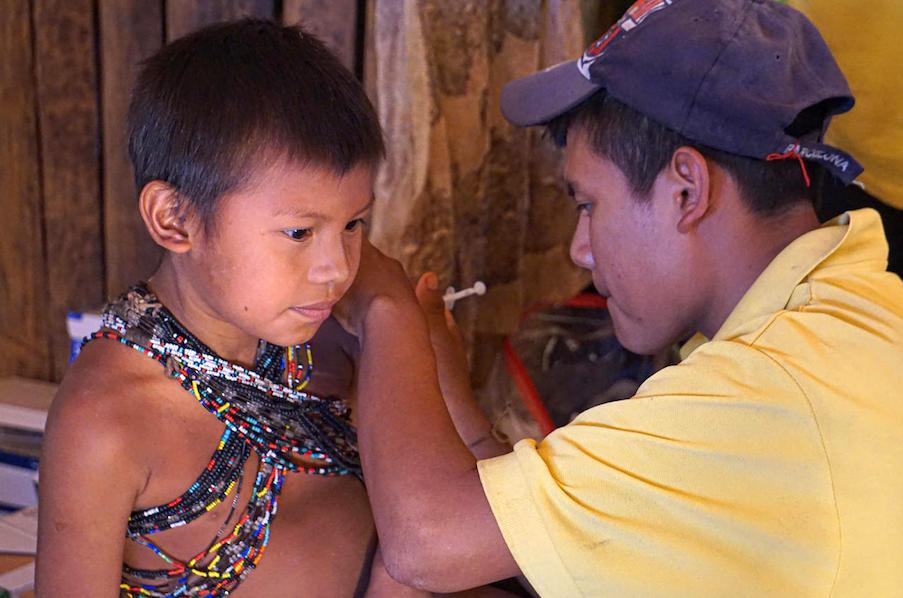 A UNICEF-supported nurse from the Hoti ethnic group vaccinates a child at the ambulatory health care center of the community of San José de Kayamá, Bolivar, Venezuela, on February 24, 2020.