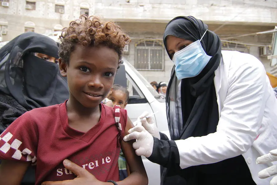 Mohammed, 13, is vaccinated against diphtheria at Khawr Meksar clinic in Aden, Yemen, as vaccinations continue despite the COVID-19 pandemic. Mohammed, 13, is vaccinated against diphtheria at Khawr Meksar clinic in Aden, Yemen, as vaccinations continue despite the COVID-19 pandemic.