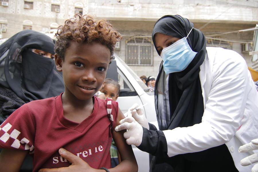 Mohammed, 13, is vaccinated against diphtheria at Khawr Meksar clinic in Aden, Yemen, as vaccinations continue despite the COVID-19 pandemic.