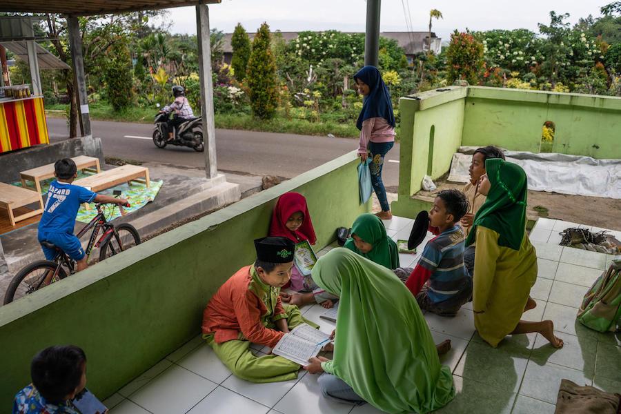 yaiful, 12, a child with a physical impairment, studies the Quran with his classmates at a UNICEF-supported school in Banyumas, Central Java, Indonesia in 2020.